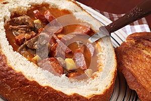 Goulash soup in a bread bowl photo