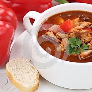 Goulash soup with meat and paprika in cup closeup healthy eating