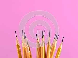 Goup of yellow pencils with pink background