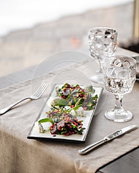 Gourmet appetizer beet salad with cheese and herbs