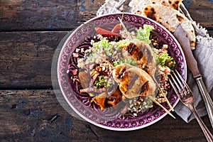 Gourmet barbecue chicken skewer dish with quinoa