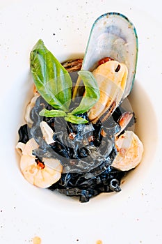 Gourmet breakfast meal black pasta seafood