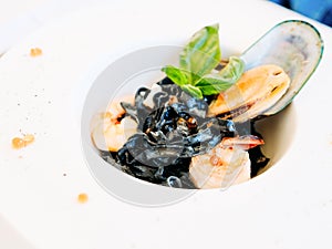 Gourmet breakfast meal black pasta seafood