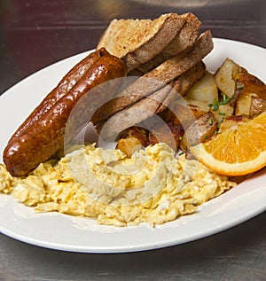 Gourmet breakfast with sausage and scrambled eggs