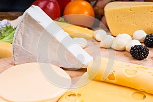 Gourmet Cheese Board Garnished with Fresh Fruit