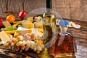 Gourmet cheese platter with alcoholic beverages