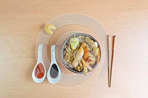 Gourmet chinese food with chopsticks. in bowl with fried rice, chicken, vegetables, chun kun
