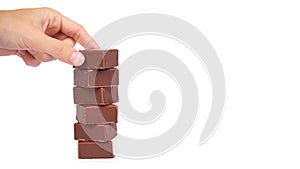 gourmet Chocolate bar in hand isolated on white background, home made sweets, unhealthy food. copy space, template