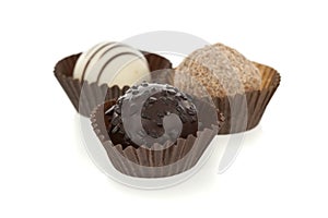 Gourmet chocolate bonbons isolated on white photo