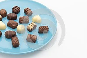 Gourmet chocolates on blue plate