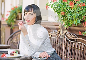 Gourmet concept. Girl relax cafe cake dessert. Pleasant time and relaxation. Delicious gourmet cake. Woman makeup face