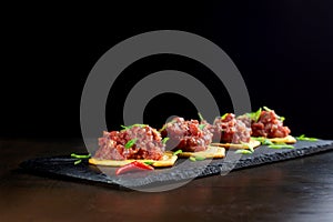 Gourmet delicacy raw meat starter on black slate-2.