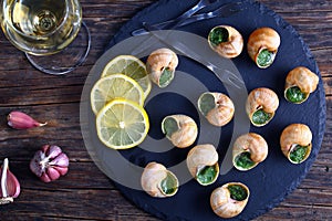 Gourmet dish - Snails with herbs, butter