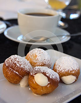 Gourmet donuts and cup of coffee