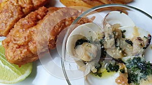 Gourmet fish and chips and clams presented in a dish