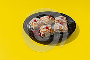 Gourmet French pastries decorated with red currant berries