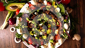 Gourmet fresh salad spinning on a food carousel