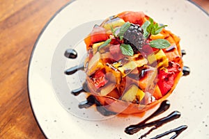 Gourmet fruit salad. Delicious low calorie dessert concept. Top view of colorful fruit salad