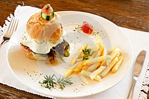 Gourmet hamburger and chips