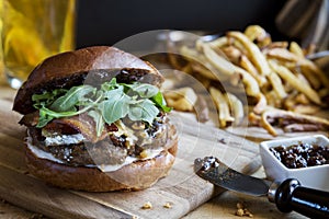 Gourmet hamburger with fig jam and french fries