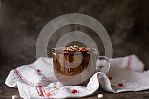 Gourmet Hot Chocolate in Glass Mug with Whipped Cream on a Dark Background