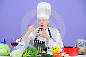 Gourmet main dish recipes. Delicious recipe concept. Girl in hat and apron. Cooking healthy food. Fresh vegetables