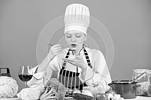 Gourmet main dish recipes. Delicious recipe concept. Girl in hat and apron. Cooking healthy food. Fresh vegetables