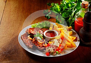 Gourmet Meat, Fries, Veggies and Cheese on Plate