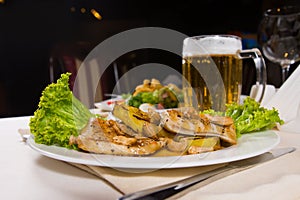 Gourmet Meaty Main Dish with Beer Mug Served