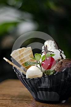Gourmet organic chocolate and strawberry ice cream sundae dessert