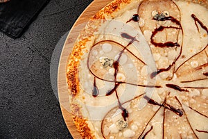 Gourmet pizza with pear and gorgonzola cheese