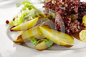 Gourmet, restaurant, delicious dinner food - close up of Potato with Pickled Vegetables Plate.