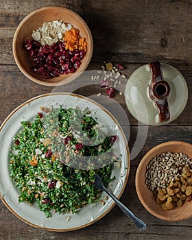 A gourmet salad on rustic surface, vertical, top view