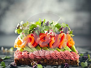 Gourmet  sandwich  with smoked salmon,avocado, beet hummus and sprouts