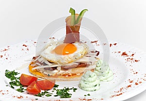 Gourmet spanish cuisine with fried egg and spanish jamÃ³n photo