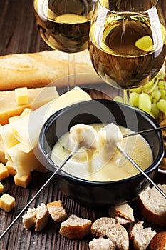 Gourmet Swiss fondue dinner on a winter evening with assorted ch