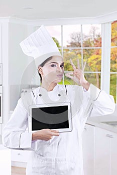 Gourmet with tablet and deliciousness gesture