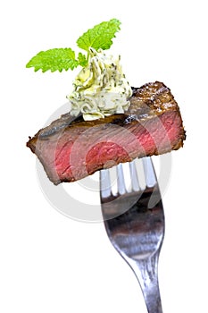 Gourmet Time,piece of a grilled steak with herb bu