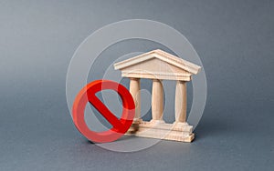 Government building or bank and symbol NO on an gray background. The concept of prohibiting and restrictive laws. photo