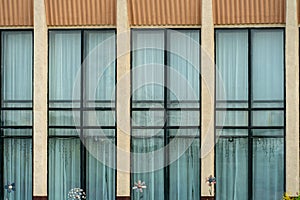 A government building with large glass windows and doors. Modern office building. Architecture and facade of the building