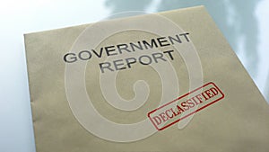 Government report declassified, seal stamped on folder with important documents photo