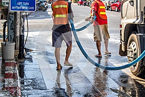Government worker cleaning the street