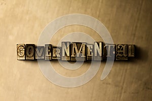 GOVERNMENTAL - close-up of grungy vintage typeset word on metal backdrop