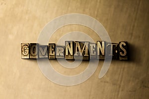 GOVERNMENTS - close-up of grungy vintage typeset word on metal backdrop