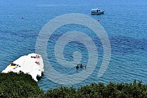 Governos Beach in summer time with people enjoyng the sea