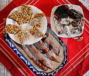 Gozinaki, Churchkhela and Dried persimmons - Georgian traditional New Year\'s table.