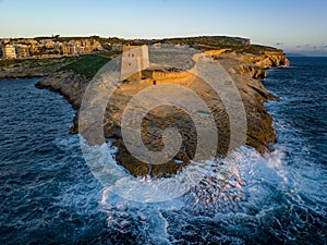 Gozo island in Malta. Rocky shores from aboveâ€”an aerial snapshot revealing the island\'s untamed coastal allure