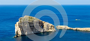 Gozo, Malta - The famous Fungus Rock on the island of Gozo on a hot summer day