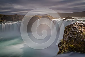 GoÃ°afoss waterfall in Iceland with dramatic cloudy sky