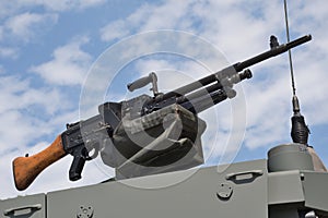 A GPMG general purpose machine gun mounted on the top of an armoured vehicle